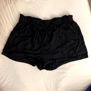 Black fabric shorts with pockets
